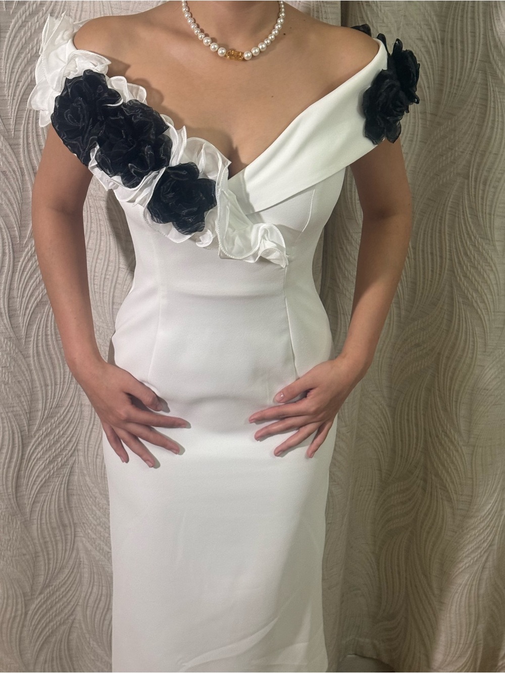 Elegant Off-Shoulder White Dress with Black Floral Accents